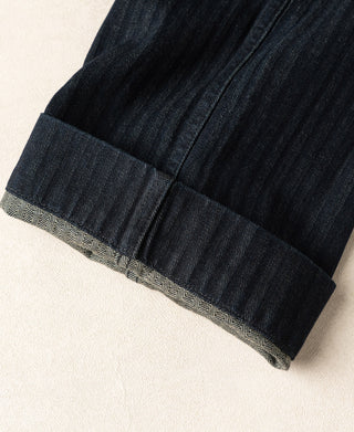 Indigo herringbone denim work pants with patterned inner facing at the hem
