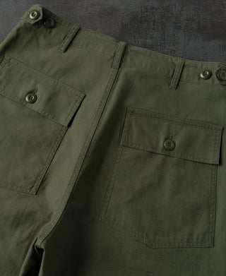 Olive cargo-style pockets with button closures and side seam detailing
