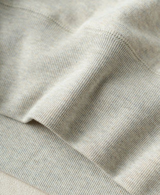 Apricot Gray ribbed hem and sleeve cuff knit close-up with soft texture