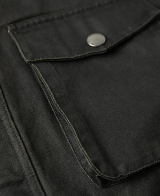 Field jacket lower pocket opening with stitched border and snap button