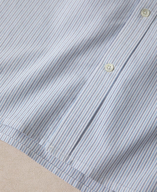 Light blue striped shirt sleeve with button detail and stitched hem