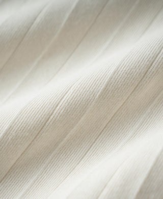 Oatmeal ribbed cotton fabric close-up showing fine vertical rib texture