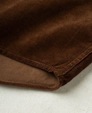 Brown corduroy shirt hem with stitched edge and ribbed cuff trim