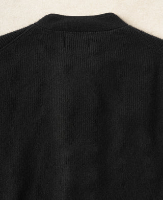 Black knit cardigan back with ribbed collar and curved yoke seam