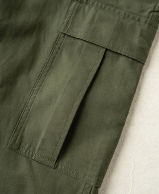 Olive cargo pants with rectangular pocket panels and stitched seams