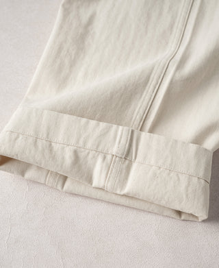 White pants cuff with stitched hem and folded bottom band