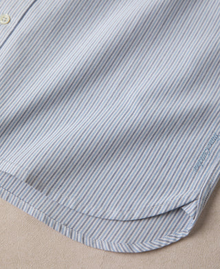 Light blue striped shirt hem with curved side seam stitching