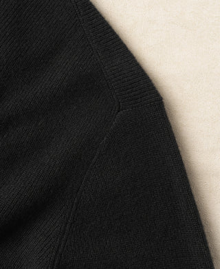 Black knit cardigan side seam detail with ribbed knit construction