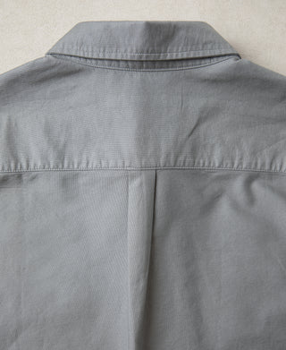 Back view of gray button-down shirt with yoke seam