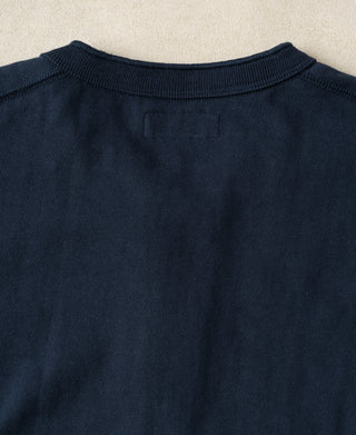 Back view of a navy loopwheel cotton Henley shirt showcasing its clean vintage silhouette.