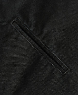 Close-up view of the angled front pocket with reinforced stitching on the Black A-2 Moleskin Bomber Jacket