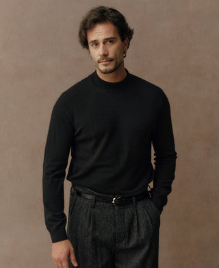 Close-up view of a black merino wool mock neck sweater highlighting the soft knit texture and elevated collar design