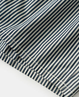 Close up view of the cotton fabric texture and vertical stripe pattern