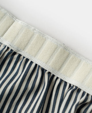 Functional pocket detail with reinforced stitching on striped boxer shorts