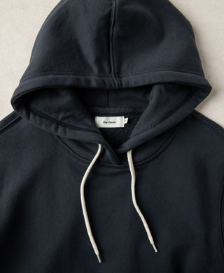 Close up of the hood construction and neckline of the dark blue hoodie