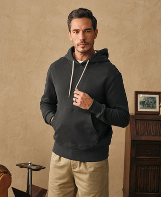 Front view of the dark gray heavyweight cotton hoodie with drawstring hood and kangaroo pocket