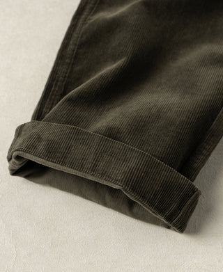 Dark green corduroy trouser leg cuff with wide ribbed hem