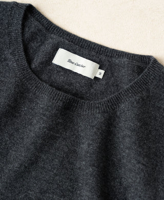 Heather gray crewneck sweater neckline with brand label at the collar