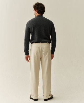Back view of a heather gray merino wool mock neck sweater highlighting the simple construction and comfortable fit