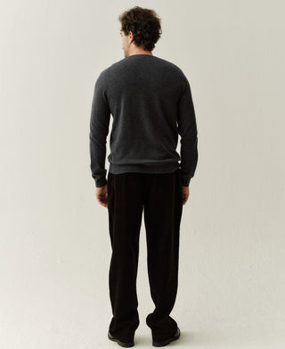 Back view of a heather gray merino wool sweater featuring a simple design and comfortable everyday fit
