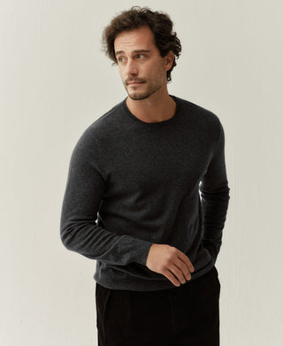 Side view of a heather gray merino wool crewneck sweater showing the relaxed fit and smooth silhouette