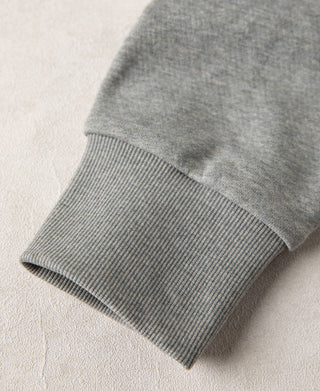 Detailed view of the kangaroo pocket edge and reinforced stitching