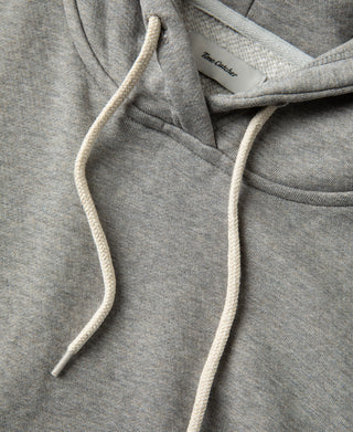 Detailed view of the cream drawstrings and neckline construction