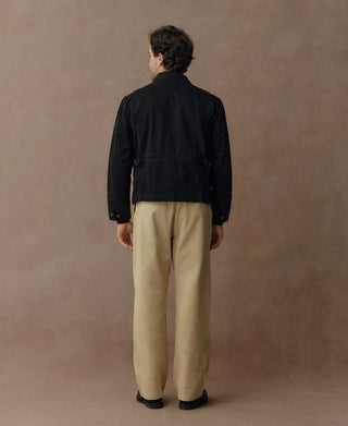 Black duck canvas cossack jacket back view with stand collar and snap cuffs