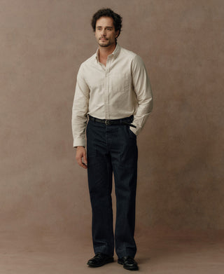 Indigo herringbone denim work pants on model with straight-leg fit