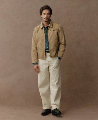 Washed khaki duck canvas cossack jacket with stand collar and chest pocket, front