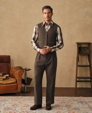Brown herringbone tailored waistcoat worn with a check shirt and matching trousers