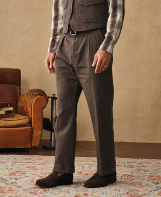 Brown herringbone double-pleated trousers with straight legs and belt loops