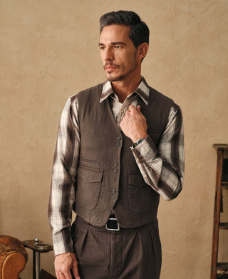 Brown herringbone tailored waistcoat with button front and welt pockets
