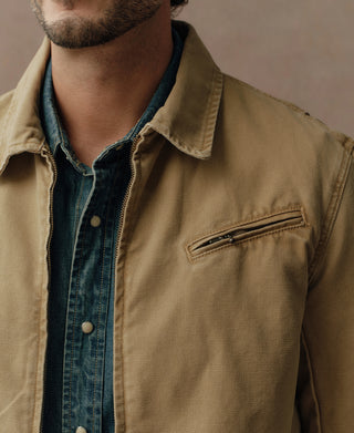 Washed khaki cossack jacket close-up with stand collar and chest pocket