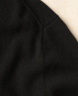 Black merino wool crewneck sweater shoulder and sleeve seam.