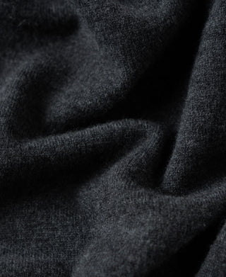 Close-up of heather gray merino wool knit fabric with soft, dense texture