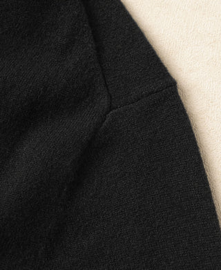 Black merino wool sweater sleeve with ribbed cuff and shoulder seam detail