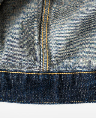 Indigo Type I denim jacket with stitched reinforcement construction.