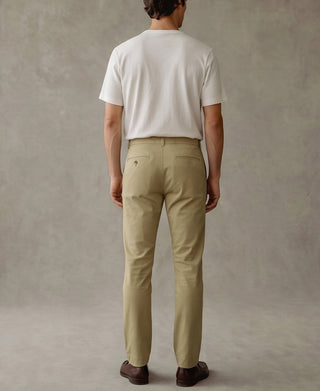 Khaki tapered cotton-blend pants, back view with belt loops and patch pockets