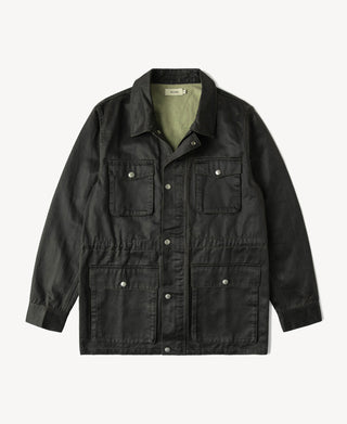 Dark olive coated field jacket with button front, flap pockets, and stand collar.