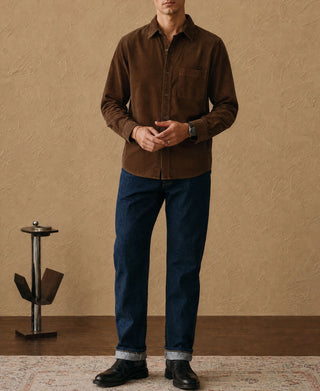Brown corduroy work shirt worn with blue jeans and dark boots