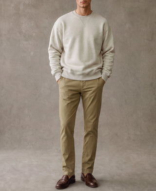 Apricot Gray crewneck sweatshirt worn with tan trousers, full-body view