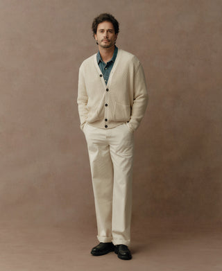 Natural cotton fisherman-rib cardigan worn with a shirt, showing its button front and pockets