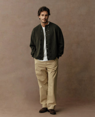 Olive knit double-breasted cardigan on model with button front