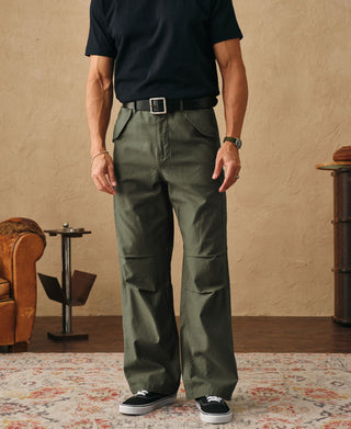 Olive field cargo pants on model with belt loops and relaxed straight legs