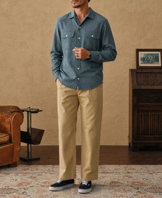 Royal blue flannel work shirt worn with tan pants and sneakers