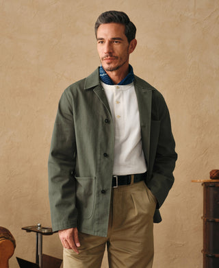 Olive field jacket with button front and chest flap pockets