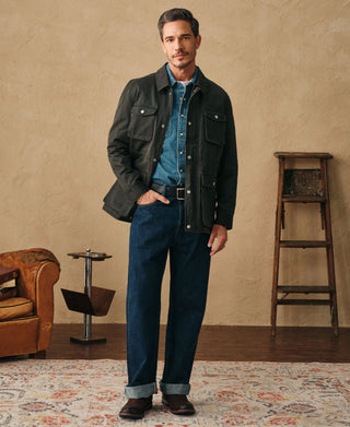 Black olive cotton-blend field jacket worn by model with front pockets and collar
