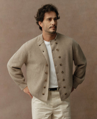 Ecru knit double-breasted cardigan with dark buttons, shawl collar, long sleeves