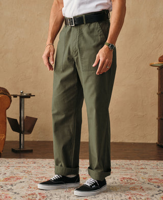 Olive fatigue pants front view with side pocket and cuffed hem